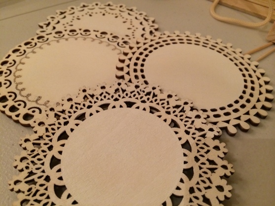 Then, we took these wooden doily looking things and painted them a cream/off-white color.  